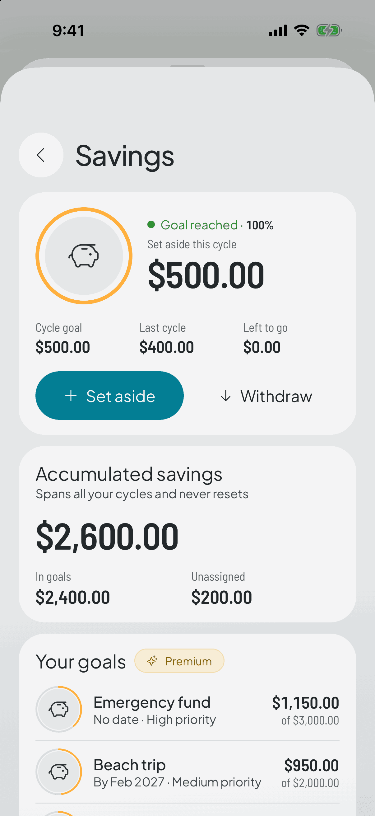 The savings screen: what's set aside this cycle, the running total that doesn't reset, and the buttons to add or take out.